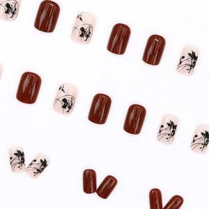 Square press-on nails with dark brown gloss and hand-painted black leaf patterns