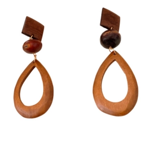 Vintage wooden teardrop earrings with a brown patchwork hollow design on white background
