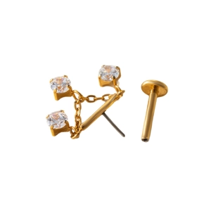 F136 titanium gold labret stud with chain and three clear zircons on white background