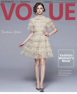 Detail of layered ruffle lace dress in beige with Peter Pan collar and embroidery
