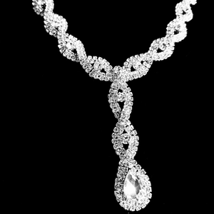 Close-up of luxury silver twisted necklace with sparkling crystal waterdrop pendant
