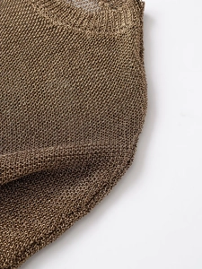 Vue macro détaillée du tissu en maille tricotée bronze métallisé avec texture premium