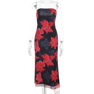 Close-up of strapless slim maxi dress with vibrant red floral print on black fabric