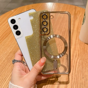 Detail of transparent phone case with gold glitter lining and magnetic ring stand