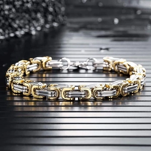 Close-up of gold and silver bicolour Byzantine chain necklace with intricate square links