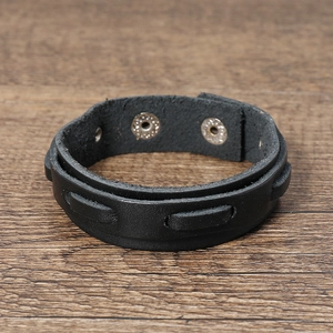 Detailed view of black genuine leather multi-layer bracelet with vintage snap fastener