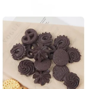Macro view of assorted chocolate cookie models with diverse shapes on vintage paper