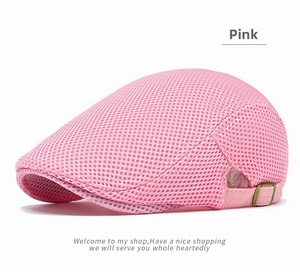 Detail of pink mesh newsboy cap showing breathable texture and metal back buckle