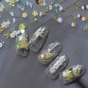 Detail of floral nail art stickers featuring cute rabbits and flowers on nails