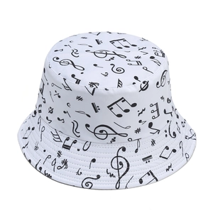 White bucket hat with black music note print, double-sided stylish outdoor sun cap
