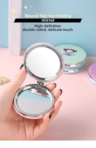 Detail showing the portable double-sided folding makeup mirror with cartoon pattern