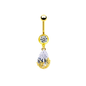 Dettaglio di piercing all'ombelico dorato con zircone a goccia e castone a fiore