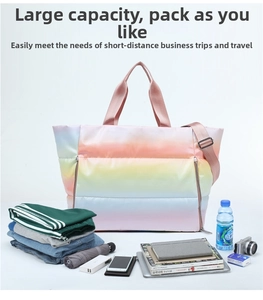 Spacious rainbow gradient quilted travel tote bag shown with packed travel essentials