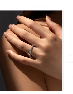 Close-up of S925 sterling silver minimalist ring with vertical ribbed industrial texture