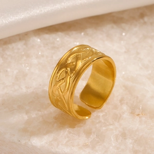 18K gold plated stainless steel wide band ring with woven texture on stone background