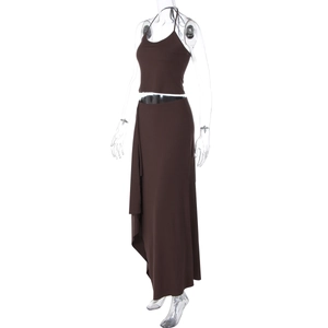 Detail of dark brown two-piece set featuring a halter top and side slit maxi skirt