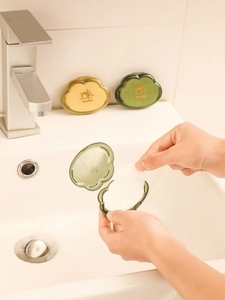 Close-up of portable cloud-shaped soap boxes being used in a clean bathroom setting