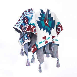 Ethnic bohemian knit shawl wrap with blue and red geometric patterns and fringe detail