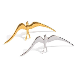 Minimalist golden and silver swallow bird rings in polished titanium steel on white background
