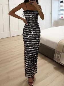 Sparkly silver disc sequins dress with thin straps and a slim fit bodycon silhouette