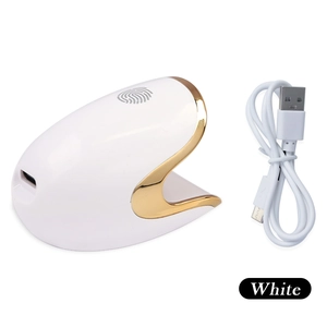 White mini portable nail lamp with touch sensor and USB cable for manicure drying