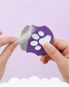 Macro shot of purple pet flea comb with fine metal teeth and cute white cat paw prints