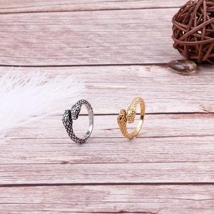 Snake shaped stainless steel open rings in gold and silver finish with scale texture