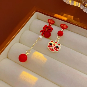 Detail of red New Chinese style earrings with Fu character and lion dance motifs
