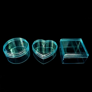 Set of transparent light blue heart, square, and round plastic storage gift boxes