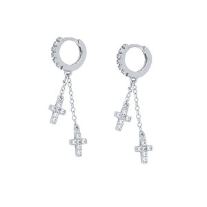 Macro shot of S925 silver hoop earrings featuring sparkling zircon cross pendants