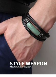 Close-up of men's black braided leather bracelet with green aventurine stone inlay