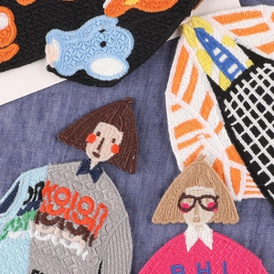 Variety of cartoon girl embroidered patches with detailed cotton needlework texture
