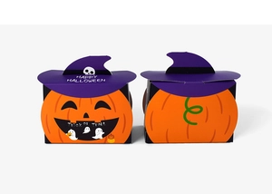 Macro view of creative Halloween pumpkin gift boxes with purple wizard hats on white background