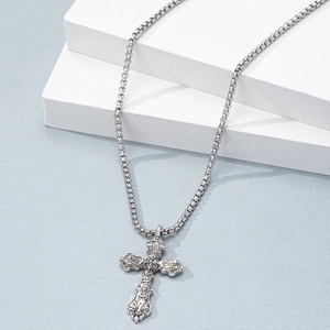 Silver retro hip hop cross pendant necklace with box chain on a geometric prop
