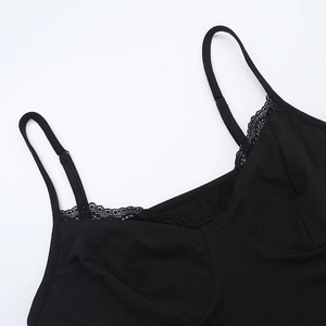 Close-up of black lace-trimmed bodysuit featuring delicate adjustable spaghetti straps