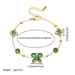 Gold stainless steel bracelet with green stone butterfly and flower pendants