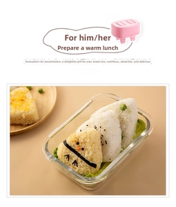 Japanese triangle rice ball mold set with seaweed decoration in a glass bento box