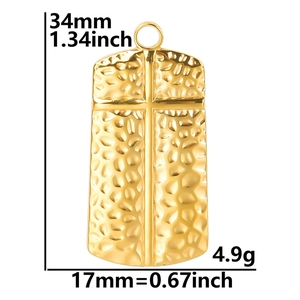 Detail of gold hammer-textured cross pendant with 34mm height and 17mm width specs