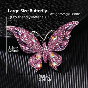 Detailed view of butterfly brooch with purple crystals and dimensions 8.8cm by 5.8cm