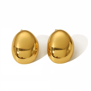 Detailed close-up of polished golden oval stainless steel stud earrings on white