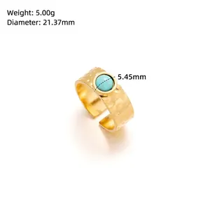 Macro shot of gold hammer texture ring with green turquoise stone inlay and dimensions