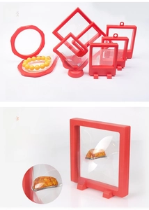 Detail view of red PE film suspension boxes in various shapes for jewelry display