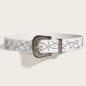 White leather punk belt with silver geometric studs and intricately carved buckle