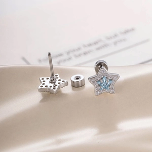Silver star earrings with blue zircon center and micro-paved sparkling crystals