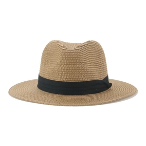 Close-up detail of finely woven Panama straw hat with black decorative fabric band