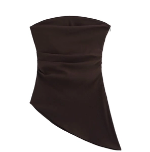 Detail of chocolate brown strapless top with ruched waist and asymmetric hemline
