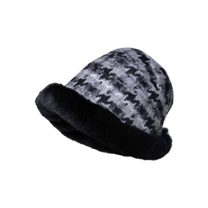 Houndstooth pattern winter bucket hat with thick black faux fur trim for cold weather