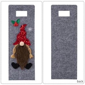 Detail of Christmas gnome wine bottle bag in grey felt with red sequin hat and handle
