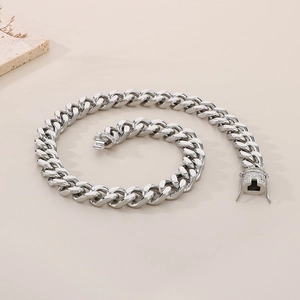 Detailed shot of silver Cuban link bracelet with iced-out CNC diamond box clasp closure