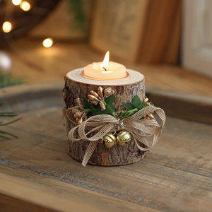 Rustic Christmas wooden candle holder with twine, gold bells, and natural bark details